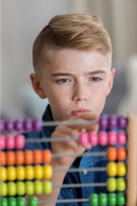 Boy focuses on counting task