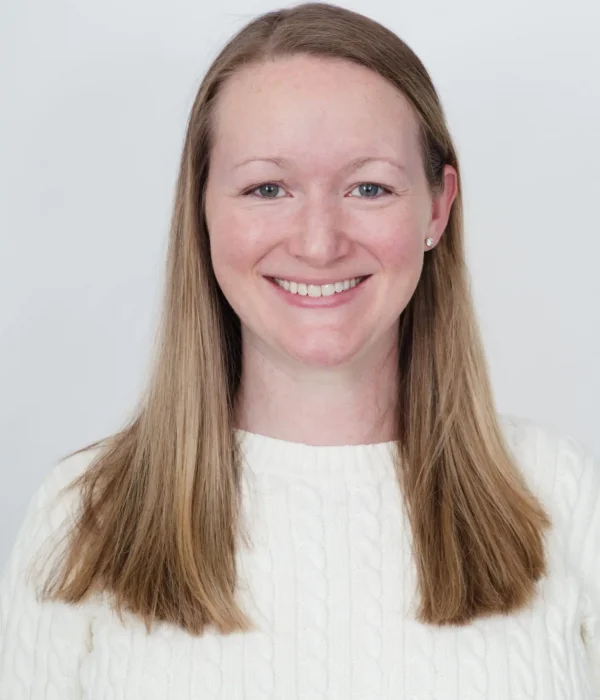Professional headshot of Caitlin Hasson, Director of Early Childhood for Evolved.