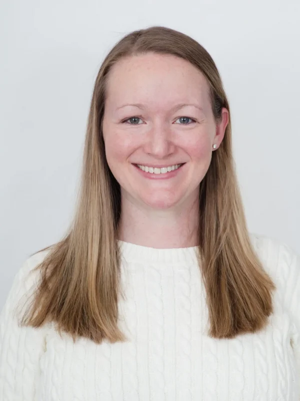 Professional headshot of Caitlin Hasson, Director of Early Childhood for Evolved.
