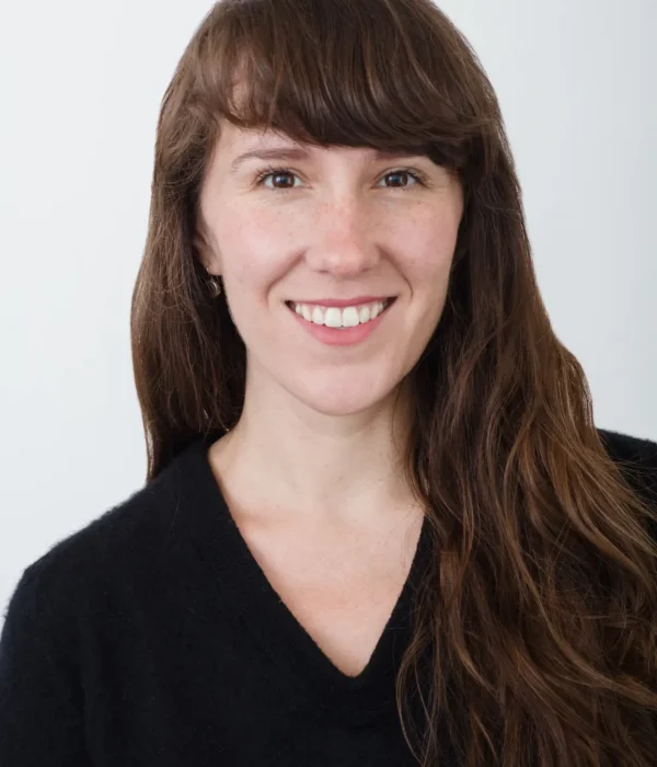 Professional headshot of Ella Pennington, Client Success Specialist for Evolved.