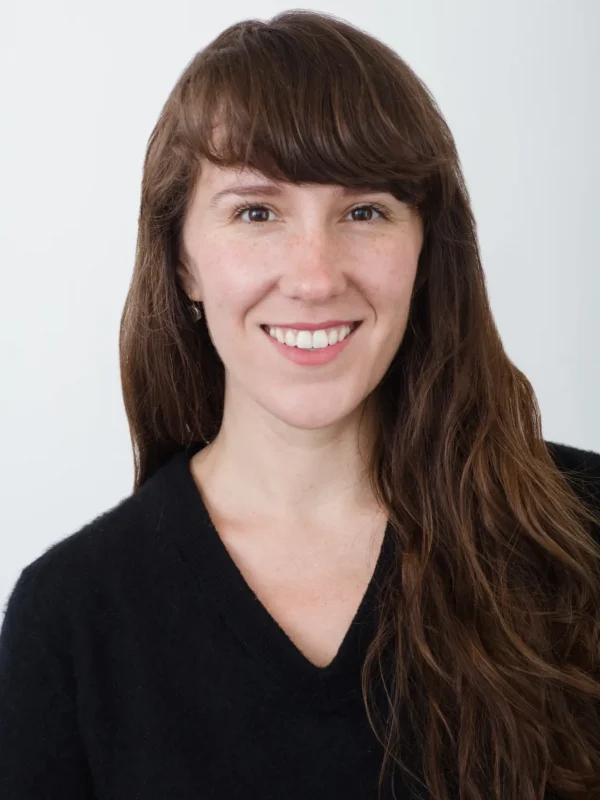 Professional headshot of Ella Pennington, Client Success Specialist for Evolved.